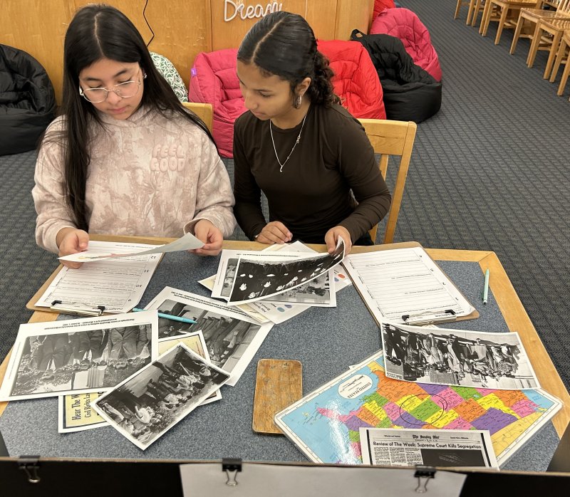 Mariner Middle School students Angie Mercado-Torres, left, and Lilly McAllister work together to learn about the Brown v. Board of Education case. SUBMITTED PHOTOS